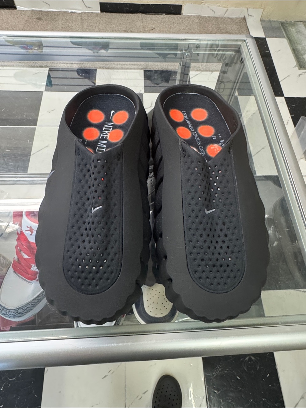 Nike Black Slip-On Perforated Foam Clogs with Orange Insole Dots